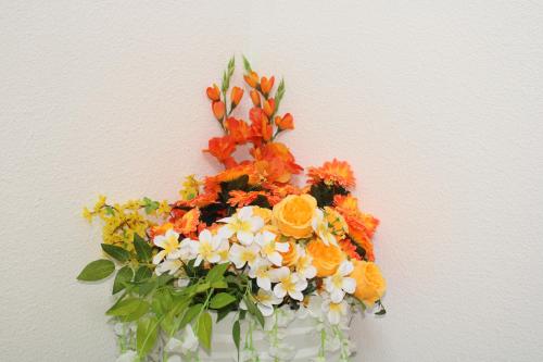 a bouquet of flowers in a white vase at Hollandia Domasa - Nová Kelča, Prešovský kraj in Kelča
