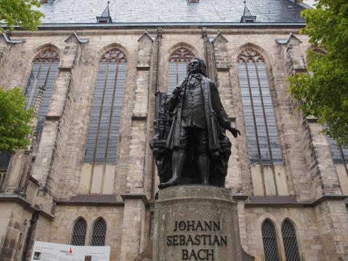 a statue of a man in front of a cathedral at REGIOHOTEL Leipzig West in Schkeuditz