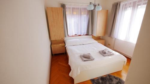Postel nebo postele na pokoji v ubytování Penzion u Bakuse