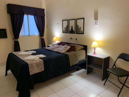 Ένα ή περισσότερα κρεβάτια σε δωμάτιο στο Hostel Del Esteko