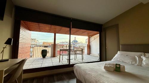A bed or beds in a room at Cosy Rooms Bolsería