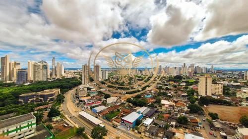 an aerial view of a city with a ferris wheel at Coruja Imob - Flat Crystal Place in Goiânia