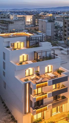 an apartment building with lights on top of it at The Meta Stay - Rooftop Access Central Studio in Athens