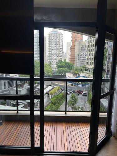 a view of a balcony with a view of a city at Flat com DUAS suítes dentro do Hotel Address Faria Lima in Sao Paulo