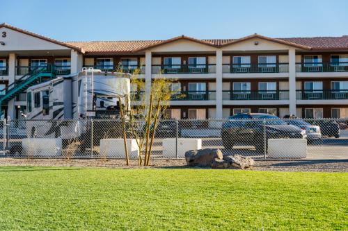 a tree in a field in front of a building at Virgin River Casino and Lodge in Mesquite