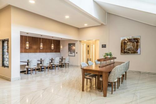 a dining room with a table and chairs at Sheraton Quito in Quito