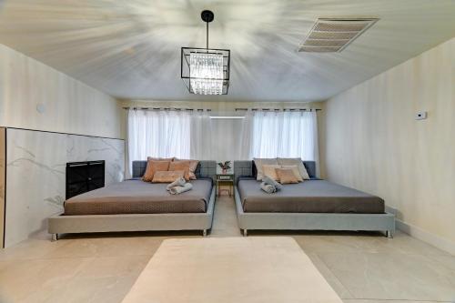 a bedroom with two beds and a fireplace at Vila Paradise-Luxury 5BD Retreat Perfect for Groups & Families in Las Vegas