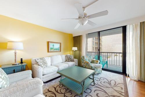 a living room with a couch and a table at Sea Colony Georgetowne House in Bethany Beach
