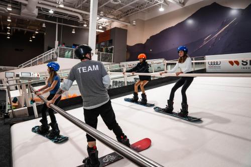 a group of people on skis on a ice rink at Holiday Inn Express Hotel & Suites Fraser Winter Park Area by IHG in Fraser