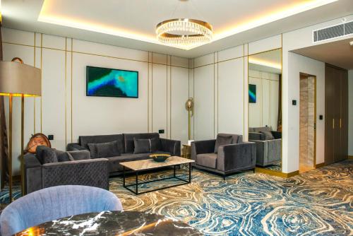 a living room with couches and a table at InterContinental Baku by IHG in Baku