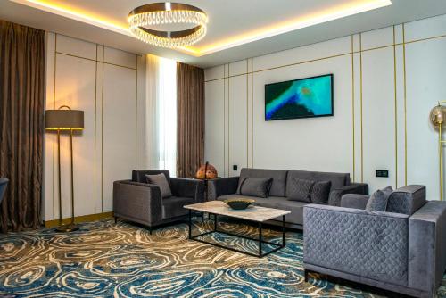 a living room with couches and a table and a couch at InterContinental Baku by IHG in Baku