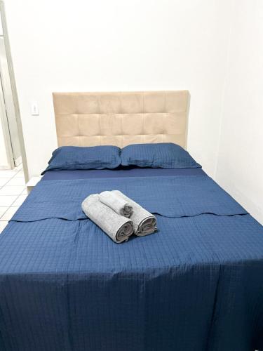 Ένα ή περισσότερα κρεβάτια σε δωμάτιο στο Casa c ar condicionado, próximo a Ufu, Parque do Sabia