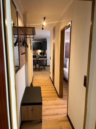 a hallway leading to a living room and a kitchen at Bergblick Appartements in Bad Gastein