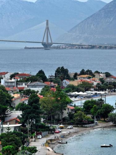 a view of a city with a bridge in the water at Holiday and Business Home in Áyios Vasílios