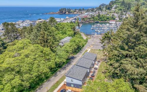 an aerial view of a town and a harbor with boats at Harbor Lights 2 Family Fun Retreat Coastal Comfort in Depoe Bay