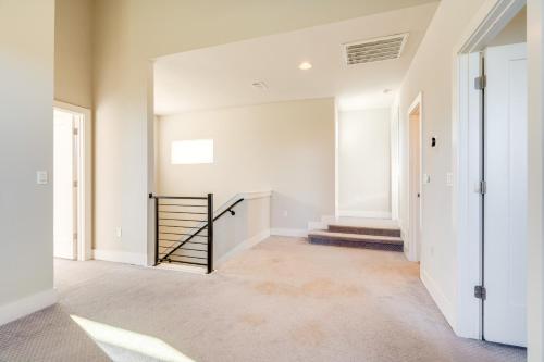 an empty hallway with a staircase in a house at 21 Mi to Dtwn Spacious Home in Austin Suburbs! in Austin