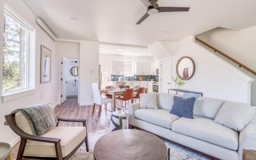 a living room with a couch and a table at Harbor Lights 2 Family Fun Retreat Coastal Comfort in Depoe Bay