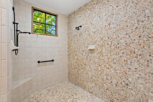 a bathroom with a shower and a window at Krisyn Vineyards in Templeton