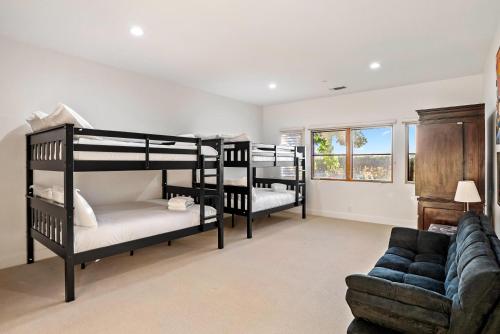 a living room with three bunk beds and a couch at Krisyn Vineyards in Templeton