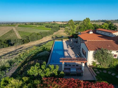 an aerial view of a house with a swimming pool at Krisyn Vineyards in Templeton