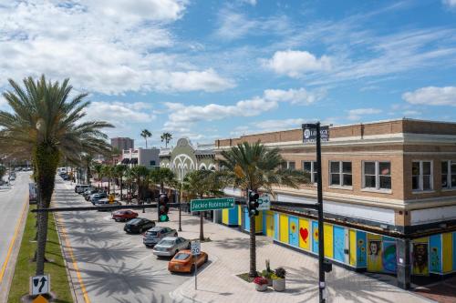 a city street with cars parked in front of buildings at Luxurious Oceanfront Haven, Newly Remodeled 1BR with All-New Furnishings at the Wyndham Ocean Walk in Daytona Beach