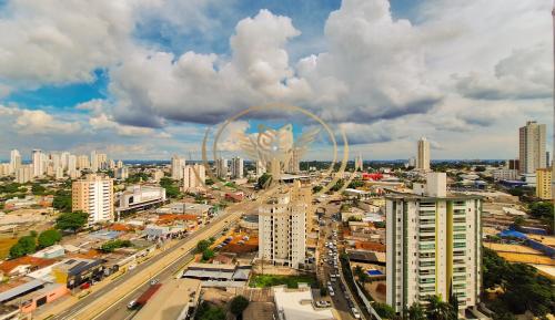 an aerial view of a city with a ferris wheel at Coruja Imob - Flat Crystal Place in Goiânia