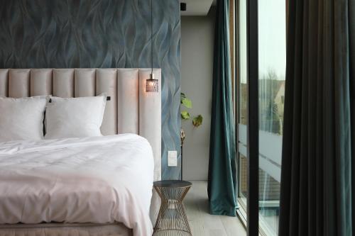 Ein Bett oder Betten in einem Zimmer der Unterkunft Per Sea