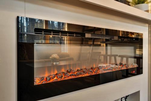 a fireplace in a living room with food inside at Moonlight at Mentone with Free Internet in Menlo