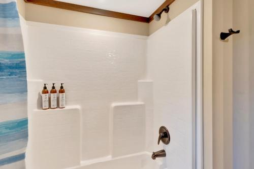 a bathroom with a shower with two bottles of wine at Black Diamond at Mentone with Free Internet in Menlo