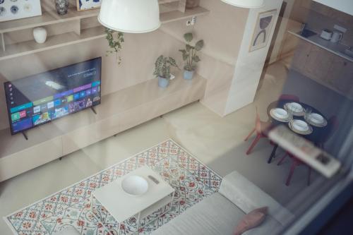 an overhead view of a living room with a tv at Premium Loft ǀ 2-Bedrooms, AC, 85 sqm, Free Parking in Bratislava