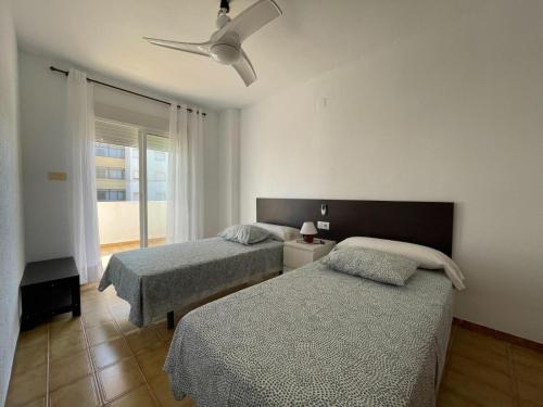 Ένα ή περισσότερα κρεβάτια σε δωμάτιο στο PEÑISCOLA CHALET 10-B Alquiler