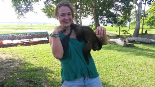 a woman in a green shirt giving a thumbs up at Avatar Amazon Lodge & Canopy Park in Santa Teresa
