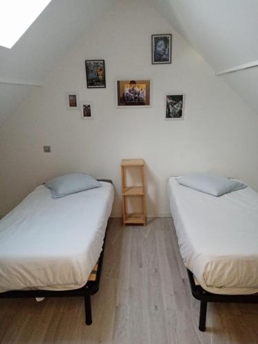 Un ou plusieurs lits dans un hébergement de l'établissement Maison neuve 2 chambres