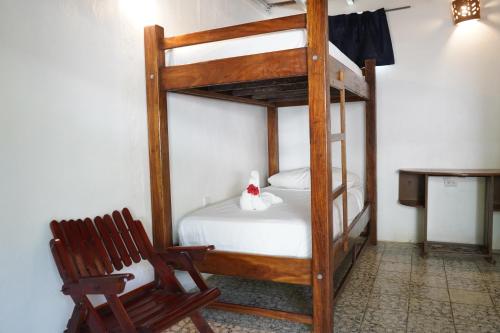 Ένα ή περισσότερα κρεβάτια σε δωμάτιο στο El Pacifico Hotel