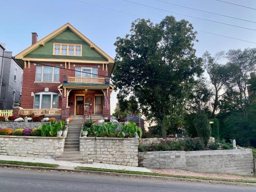 a house with a garden in front of it at The Edmond an 1887 Arts & Crafts gem in Saint Joseph