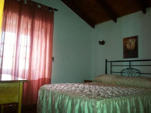 Ένα ή περισσότερα κρεβάτια σε δωμάτιο στο Casa Rural Los abuelos, El Hierro, Frontera