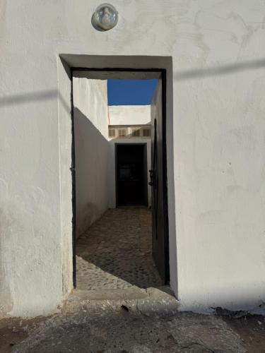 an open door into a hallway in a building at La Porte sur l'océan in Sidi Kaouki