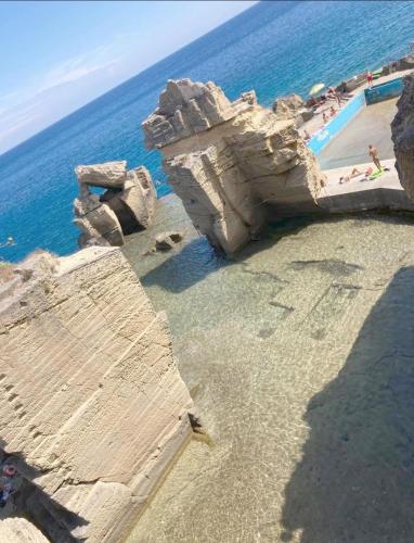 an aerial view of a rock formation in the ocean at B&B Passione Salento in Surbo