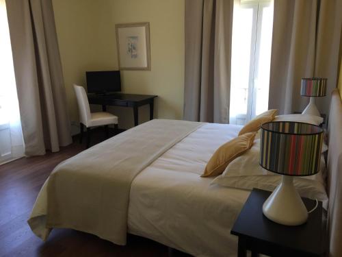 Ένα ή περισσότερα κρεβάτια σε δωμάτιο στο Casa do Alfaro