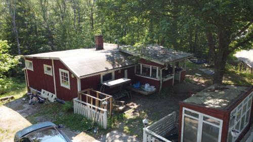 an aerial view of a red house in the woods at Boamark Sweden in Mörrum