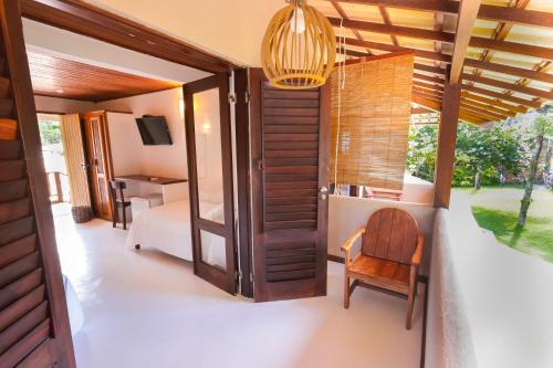 Μια τηλεόραση ή/και κέντρο ψυχαγωγίας στο Hotel Pousada Coqueiros