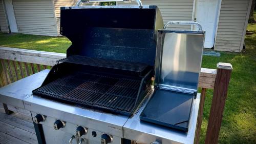 a grill is sitting on top of a yard at Choo Choo Inn in Elkhart