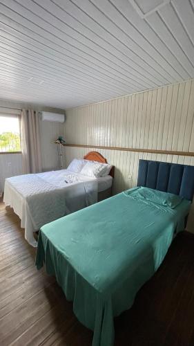 Postel nebo postele na pokoji v ubytování Casa Familiar com 2 Quartos
