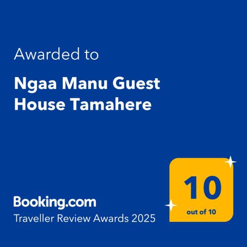 a yellow sign that reads awarded to nza main guest house tamander at Ngaa Manu Guest House Tamahere Hamilton in Rukuhia
