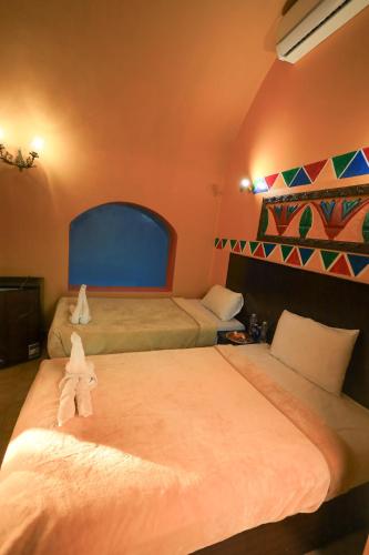 Cama o camas de una habitación en Nubiano Cataract