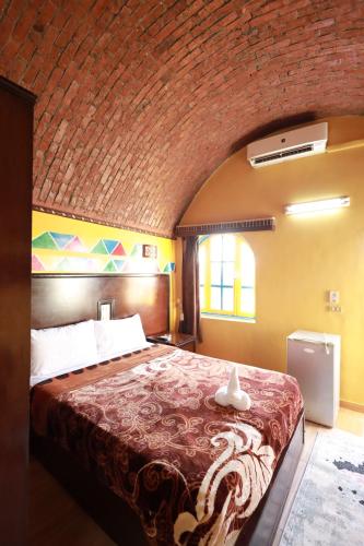 Cama o camas de una habitación en Nubiano Cataract