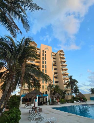 a view of the hotel from the pool at Cancun Beach & Nightlife Paradise SALVIA CONDOMINIUMS in Cancún