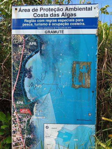 a sign with a map of the area of tropical anticoatal costa gas at Casa Praia Reserva - Casa Completa no Paraíso in Aracruz