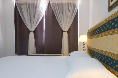 Ένα ή περισσότερα κρεβάτια σε δωμάτιο στο Casa kretcheu Mindelo