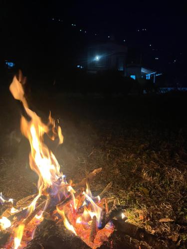 a bonfire on the beach at night at The Hidden Cove in Bhīm Tāl